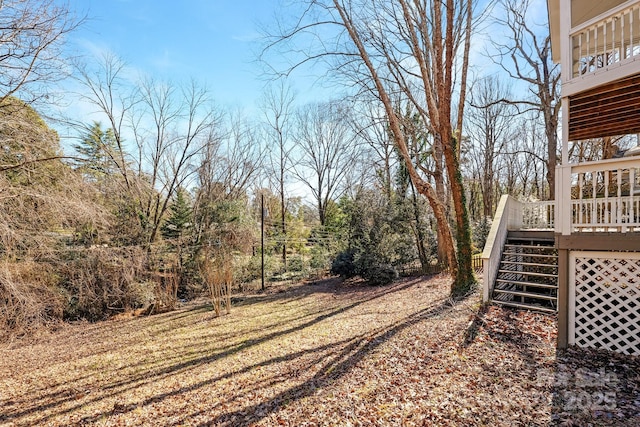 view of yard with a wooden deck