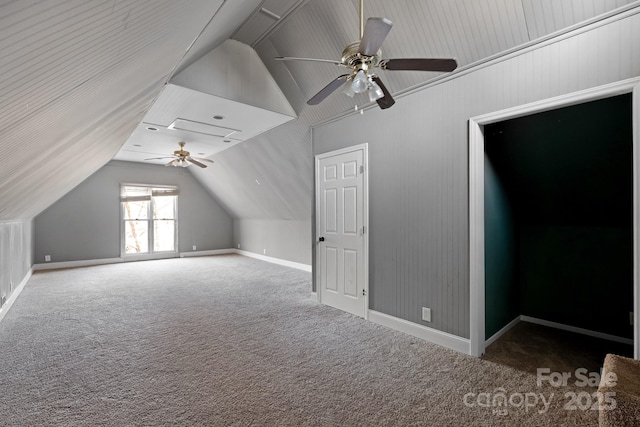 bonus room with vaulted ceiling, carpet flooring, and ceiling fan