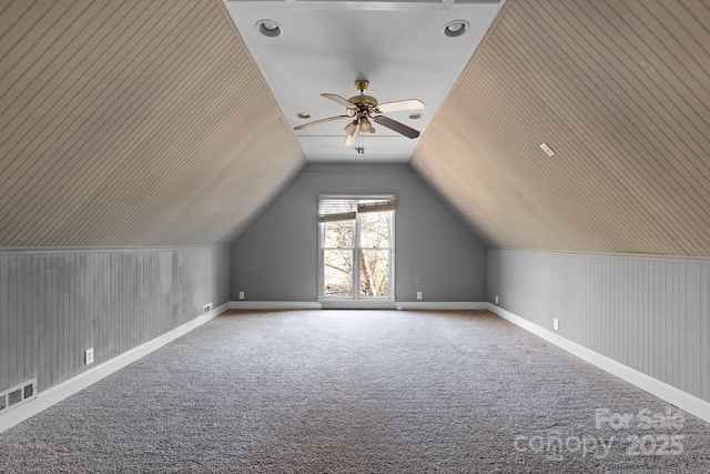 bonus room with carpet, lofted ceiling, and ceiling fan