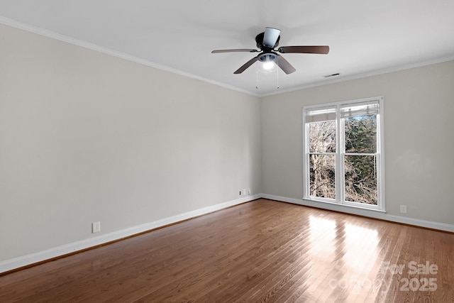 unfurnished room with hardwood / wood-style flooring, ceiling fan, and ornamental molding