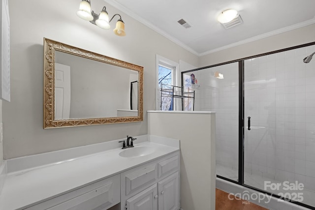 bathroom featuring an enclosed shower, vanity, and ornamental molding