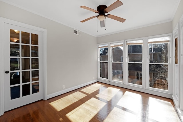 spare room with crown molding, ceiling fan, and wood-type flooring