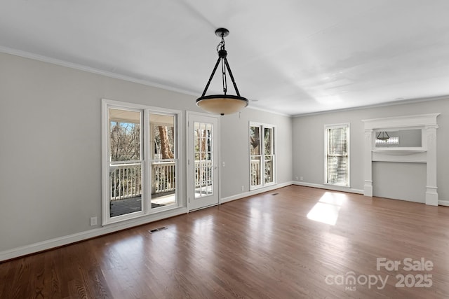 unfurnished dining area featuring wood-type flooring and ornamental molding