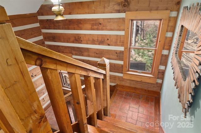 stairway with wooden walls