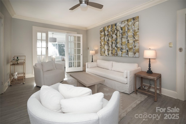 living room with ceiling fan, ornamental molding, and dark hardwood / wood-style flooring