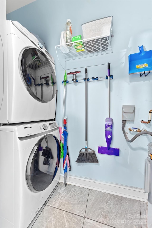 washroom with stacked washer / dryer