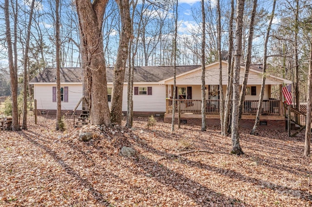 rear view of property with covered porch