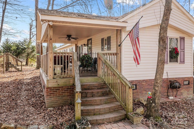 exterior space with ceiling fan and a porch