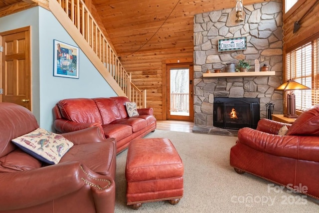175 Owl Lookout Rd, Sylva, NC 28779 - carpeted living room with wood ceiling, high vaulted ceiling, a fireplace, and log walls