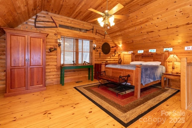 175 Owl Lookout Rd, Sylva, NC 28779 - bedroom with vaulted ceiling, log walls, wood ceiling, and light hardwood / wood-style flooring