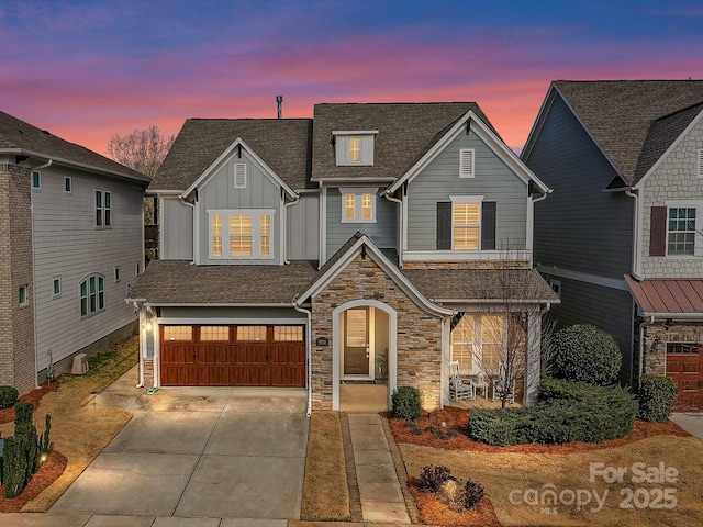 view of front of property with a garage