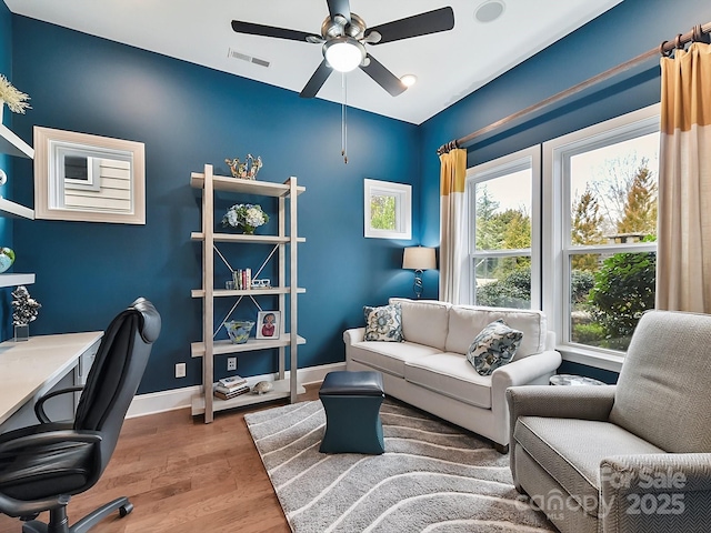 office featuring hardwood / wood-style flooring and ceiling fan