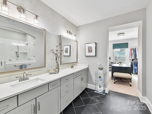 bathroom featuring vanity, an enclosed shower, and tile patterned flooring