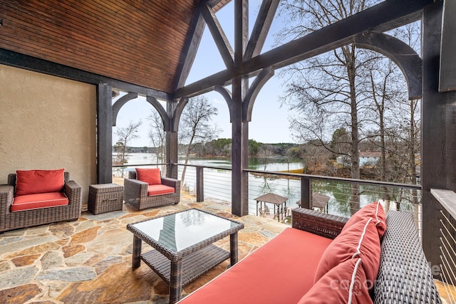 view of patio / terrace with a water view and an outdoor hangout area