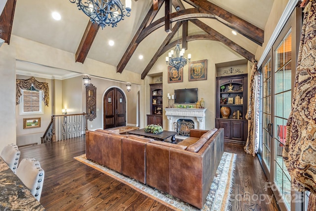 living room with beam ceiling, dark wood-type flooring, high vaulted ceiling, and a chandelier