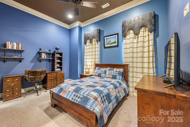 bedroom with crown molding, light colored carpet, and ceiling fan