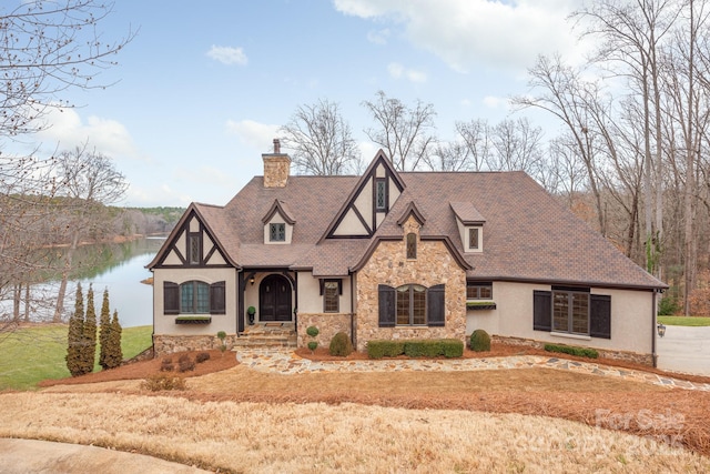 tudor house with a water view