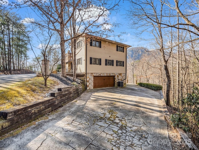 view of side of property featuring a garage