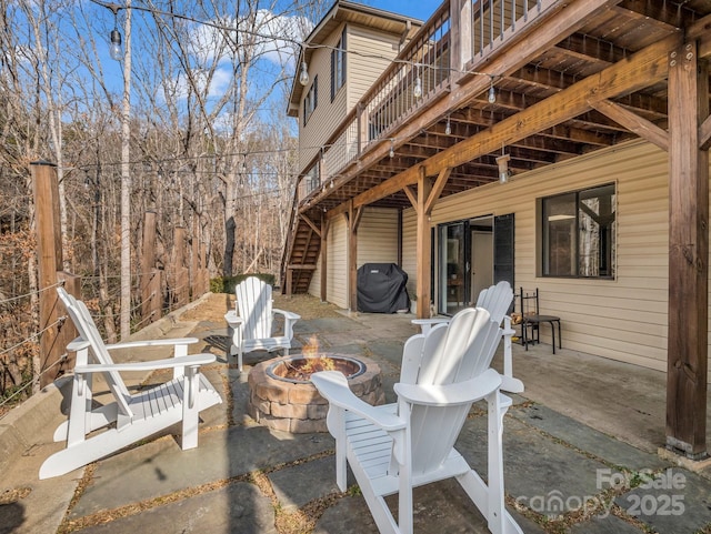 view of patio featuring a grill and an outdoor fire pit