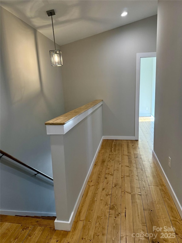 corridor featuring light hardwood / wood-style floors