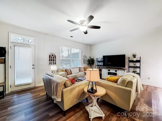 living room with dark wood-type flooring and ceiling fan