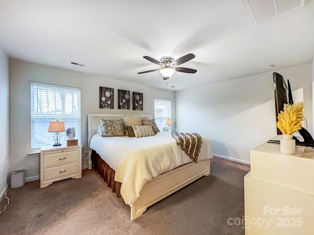 carpeted bedroom with multiple windows and ceiling fan