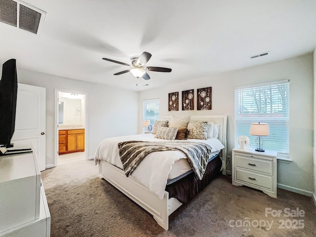 carpeted bedroom featuring multiple windows and ceiling fan