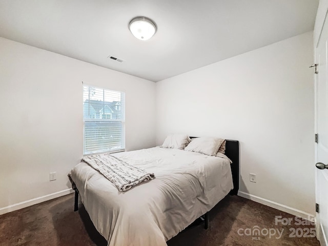 bedroom with dark carpet