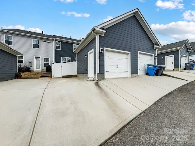 view of property exterior with an outbuilding and a garage