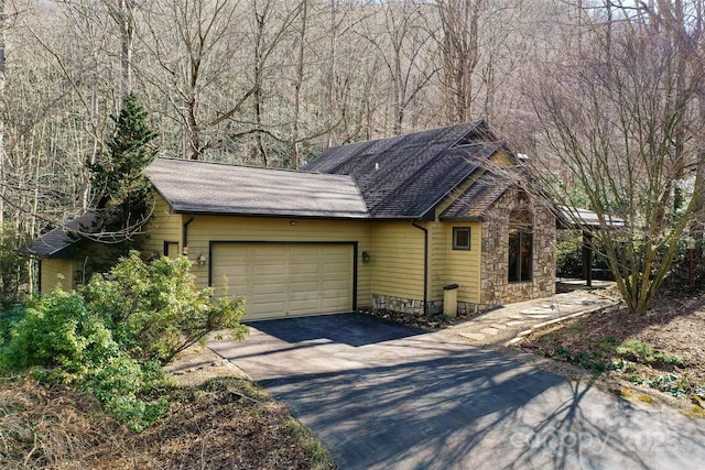 view of side of home featuring a garage