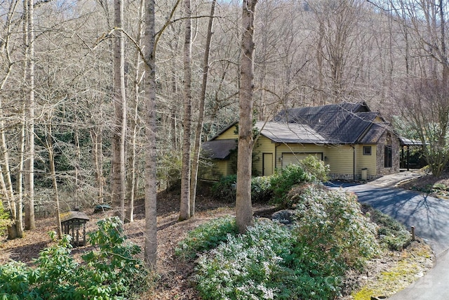 view of side of home with a garage