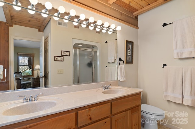 bathroom featuring beamed ceiling, vanity, an enclosed shower, wood ceiling, and toilet