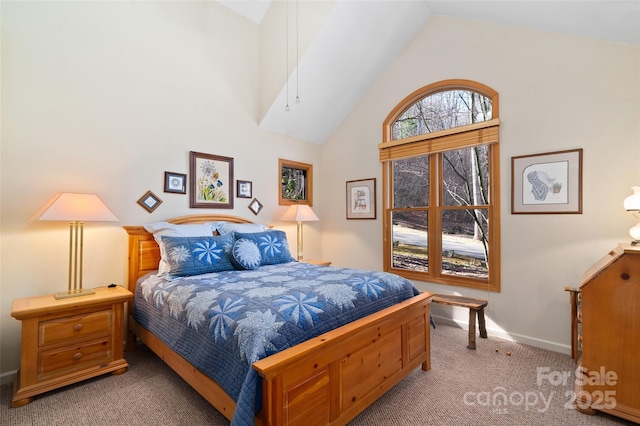 carpeted bedroom featuring high vaulted ceiling