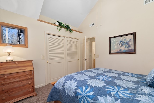 carpeted bedroom featuring high vaulted ceiling and a closet