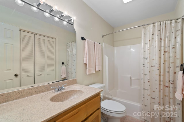 full bathroom featuring vanity, shower / bathtub combination with curtain, tile patterned floors, and toilet