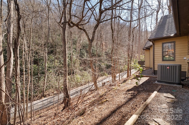 view of yard with central AC unit