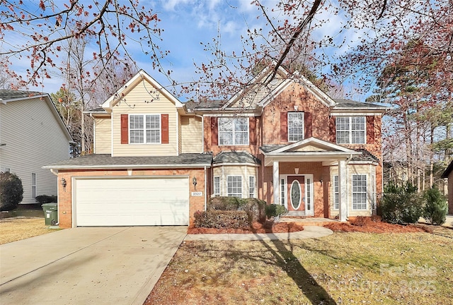 view of front of home featuring a garage and a front lawn