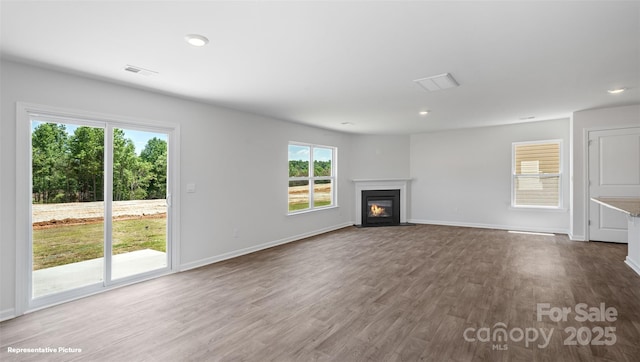 unfurnished living room with hardwood / wood-style floors