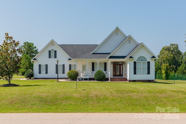 view of front of home with covered porch and a front lawn