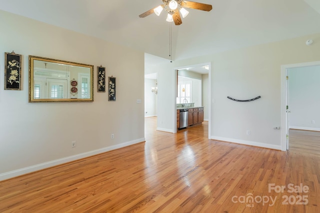 unfurnished living room featuring ceiling fan and light hardwood / wood-style floors