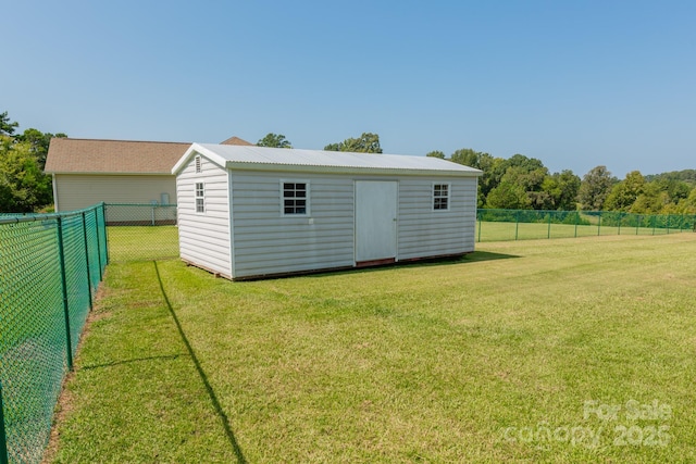 view of outbuilding featuring a lawn