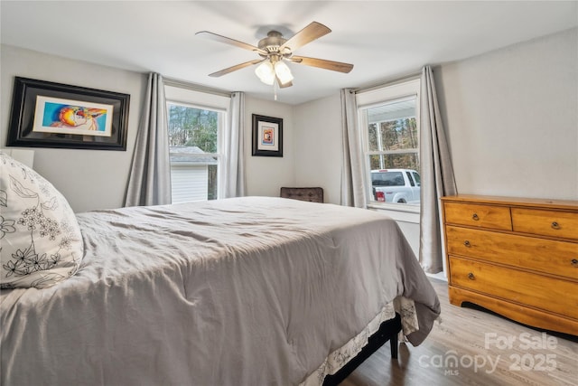 bedroom featuring wood-type flooring and ceiling fan