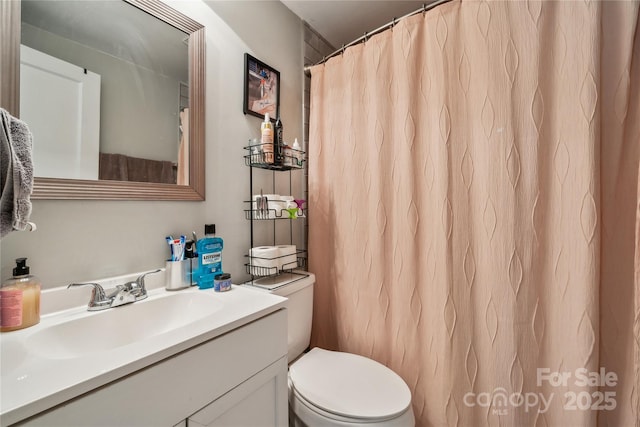 bathroom with vanity and toilet