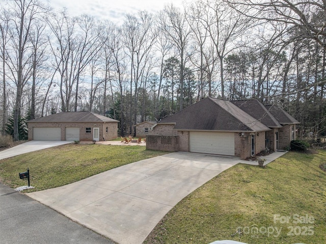 single story home with a garage, roof with shingles, a front lawn, and brick siding