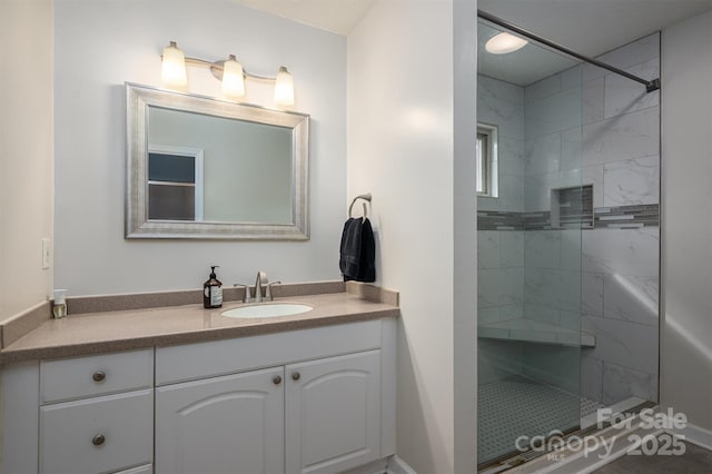 bathroom featuring a stall shower and vanity