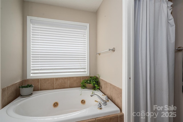 bathroom with a tub with jets