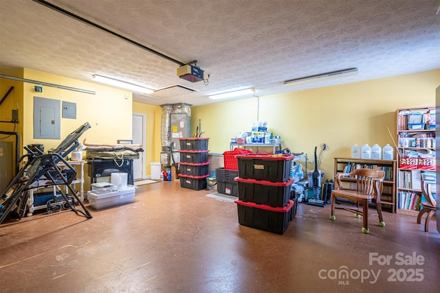 garage with a garage door opener and electric panel