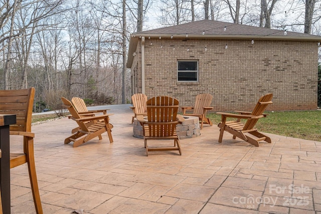 view of patio / terrace with an outdoor fire pit