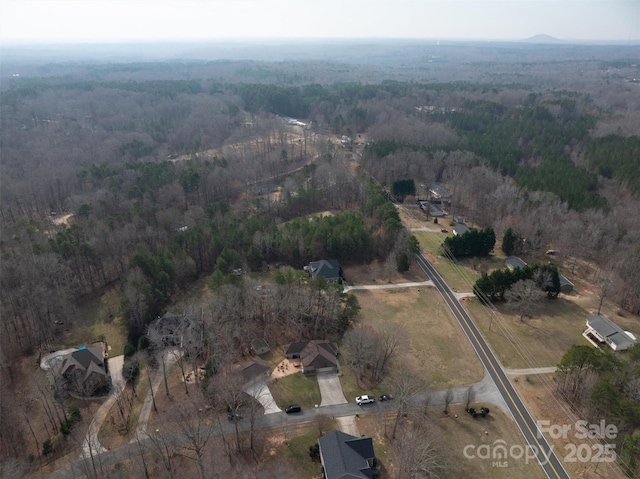 aerial view with a rural view and a view of trees