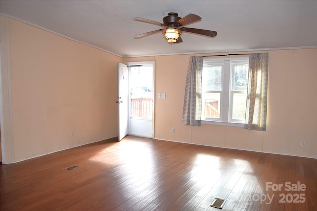 unfurnished room featuring ceiling fan, ornamental molding, and light wood-type flooring